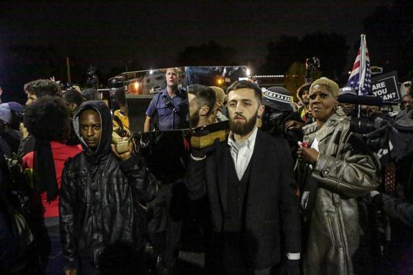 Various Authors, ‘The Mirror Casket’, 2014. Protesters carry the casket in front of police station. Ferguson (MO). Photo: Lawrence Bryant/St. Louis American.